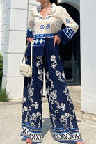 Mediterranean two-piece set women's outfit with blue and white porcelain print, long sleeve blouse and wide-leg pants.