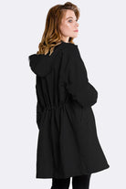 Black Travel-Smart waterproof hooded windbreaker for women with adjustable hood and tailored silhouette