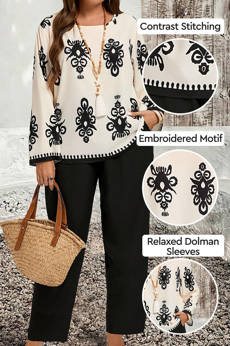 Plus Size Easy Elegance set featuring embroidered black and white motif top with dolman sleeves and black pants