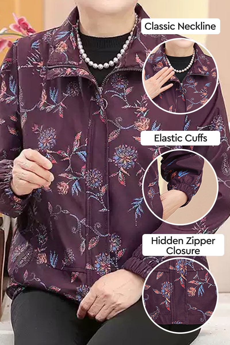 Plus Size WeatherShield floral jacket with classic neckline, elastic cuffs, and hidden zipper closure in purple floral pattern