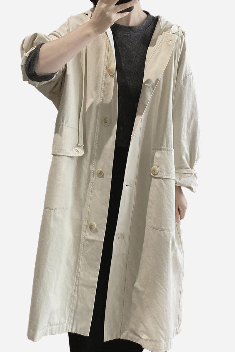 One size travel-ready hooded windbreaker in natural cotton with snap buttons and pockets