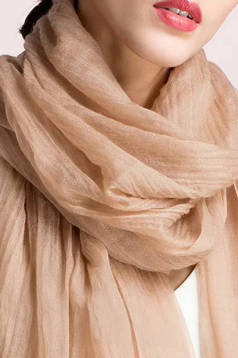 100 cashmere featherlight luxury scarf in soft beige wrap around woman's neck