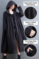One size oversized all-weather water-resistant windbreaker with adjustable waist drawstring, elastic cuffed sleeves, and deep side pockets in black