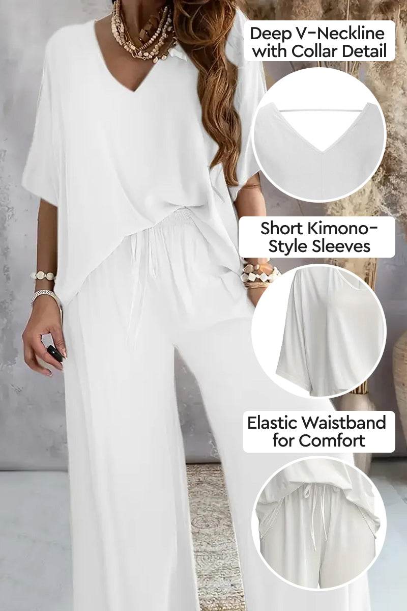 White two-piece pantsuit with deep V-neckline, short kimono sleeves, and elastic waistband for comfort