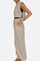 Breathable cotton-linen blend sleeveless two-piece outfit with relaxed fit pants and side tie top in beige