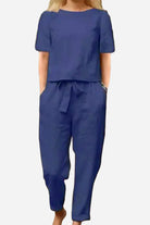 Woman wearing a navy blue cotton-linen blend relaxed fit two-piece set with short sleeves and drawstring pants