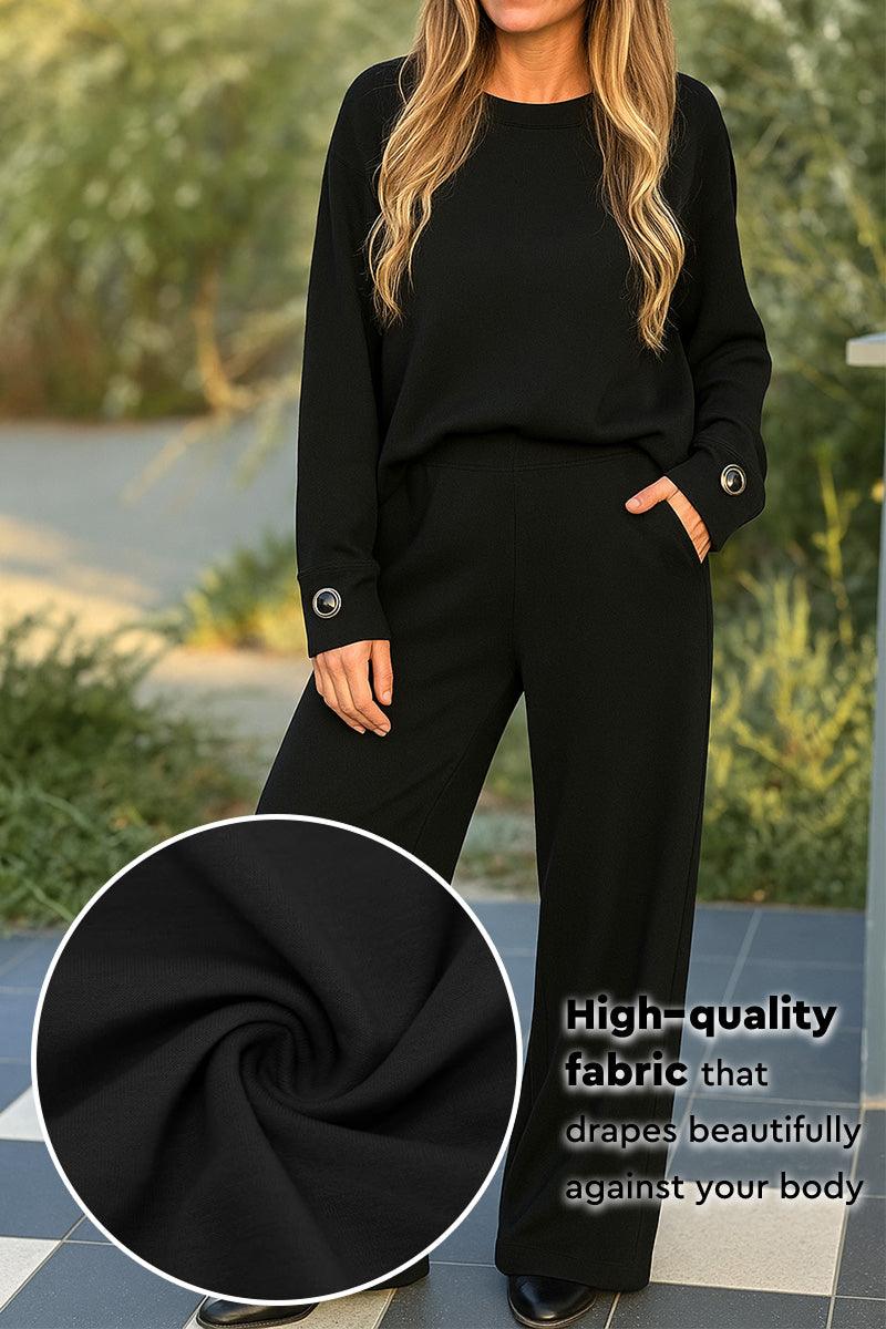 Black two-piece set with relaxed fit and button-cuff sleeves in soft high-quality fabric
