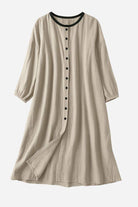 100% linen oversized button-down tunic dress in neutral beige with black contrast collar and buttons