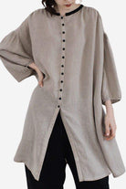 100% linen oversized button-down tunic in neutral grey with flowy sleeves and contrast buttons