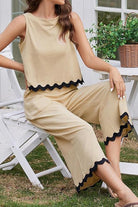 Beige scalloped trim sleeveless top and wide leg pants set with black wavy hem detailing