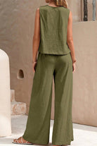 Woman wearing olive green sleeveless wide leg pants set with soft, wrinkle-resistant fabric, perfect for travel and casual occasions