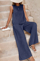 Woman wearing navy sleeveless wide leg pants set with a relaxed fit and soft fabric