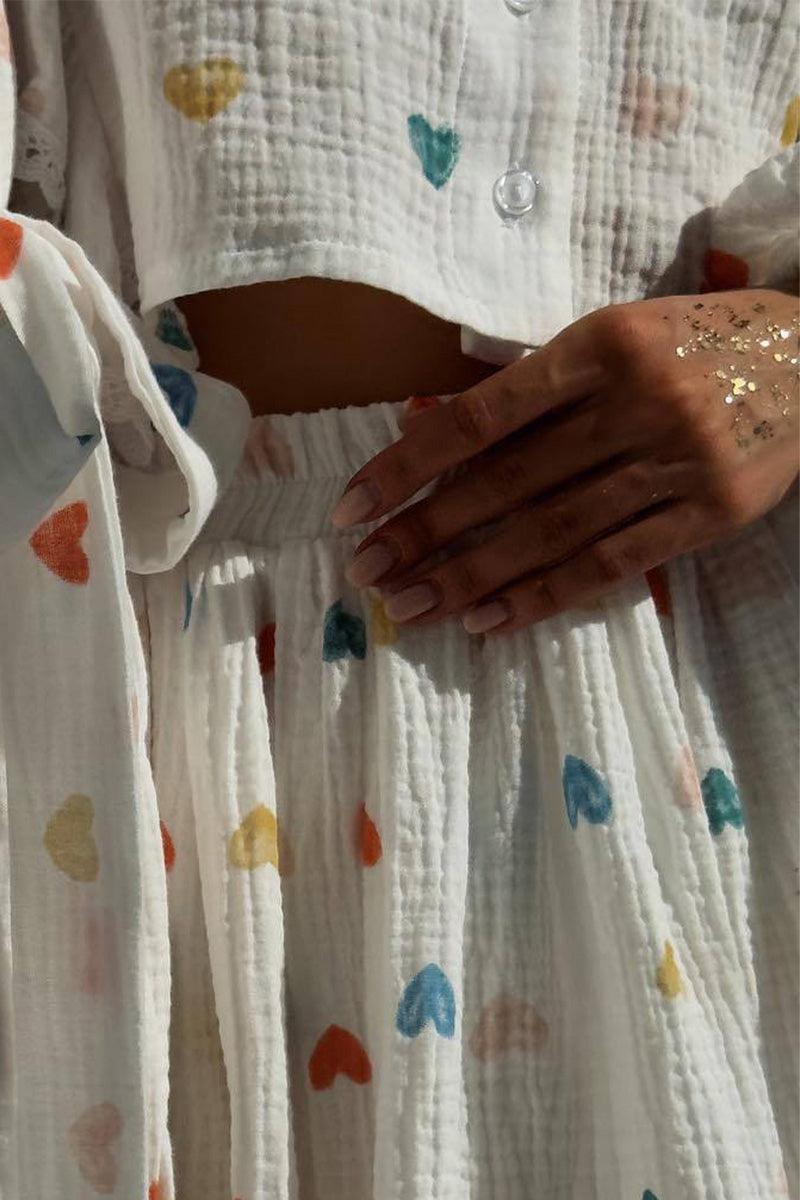 Close-up of Sweet Countryside 100% Cotton ruffled two-piece set with colorful heart prints and textured fabric