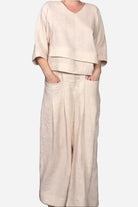 Atelier Serenity Layered Two-Piece Set beige relaxed fit layered V-neck top and wide-leg trousers