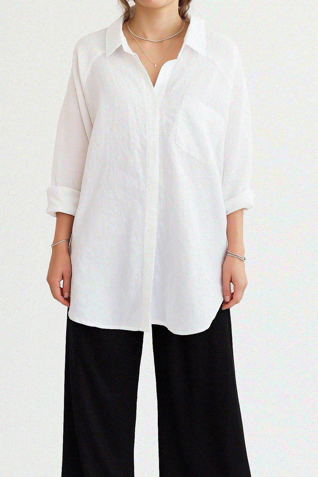 Woman wearing white linen-cotton blend relaxed shirt and black high-waist palazzo pants, Linen Breeze Set summer outfit