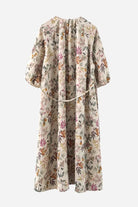 Back view of Italian Summers 100% Linen maxi dress with floral print and tie-back detail