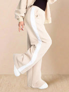 Women wearing wrinkle-resistant Easy Airport Lounge Set with zip-front jacket and wide-leg pants