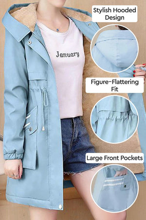 Cityscape Comfort Hooded Windbreaker with plush lining, stylish hood, figure-flattering fit, and large front pockets in light blue