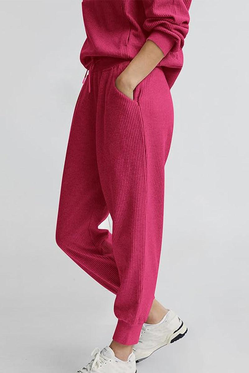 Unisex half-zip pullover and sweatpants set in pink ribbed fabric with casual fit and pockets
