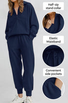 Unisex half-zip pullover and sweatpants set in navy with stand collar, elastic waistband, and side pockets