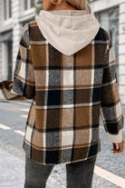 Back view of Countryside Layered Hoodie with brown plaid pattern and beige hood on woman outdoors