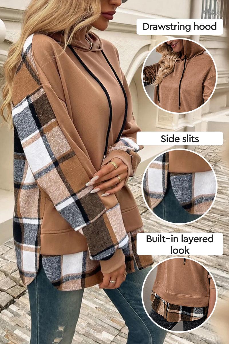Woman wearing brown Countryside Layered Hoodie with plaid sleeves, drawstring hood, side slits, and built-in layered plaid hem.