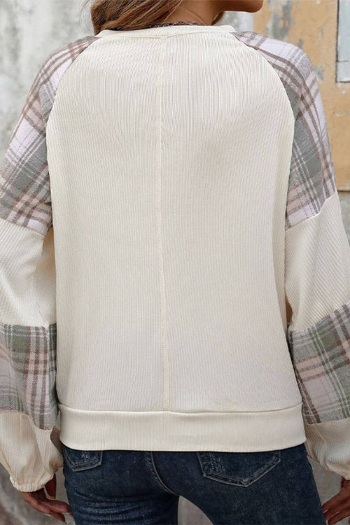 Back view of waffle knit sweatshirt with plaid sleeves and relaxed fit