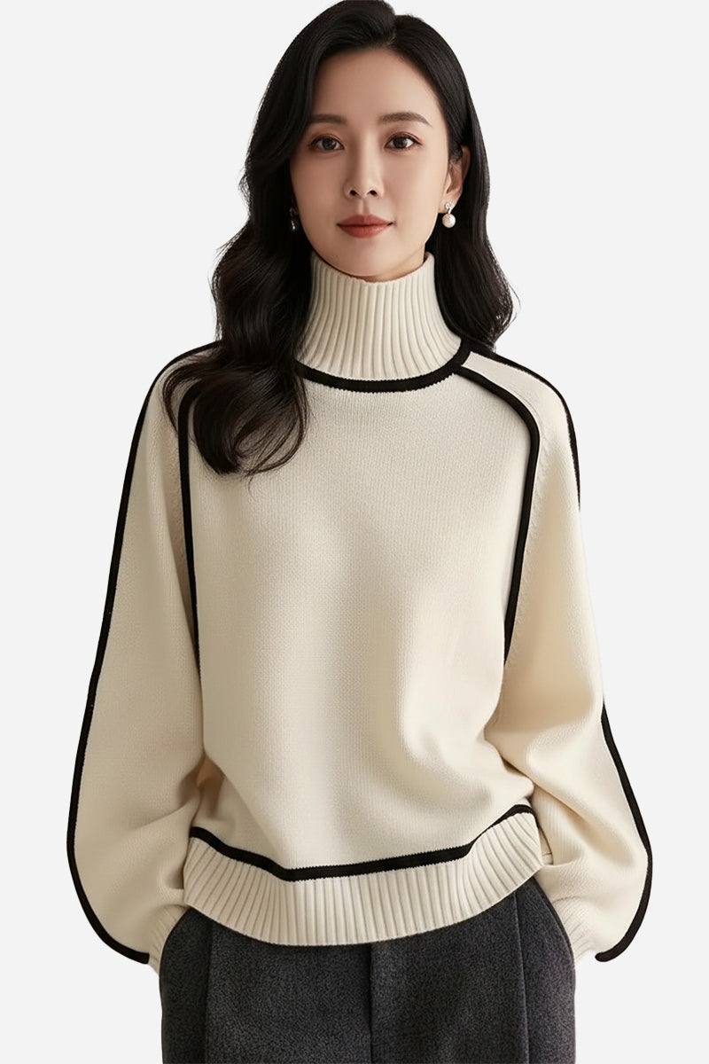 Woman wearing a cream Zero Itch Turtleneck Sweater with black contrast trim and relaxed fit