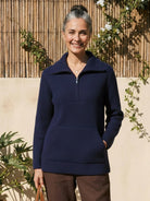 Half-Zip waffle knit pullover with kangaroo pocket and fold-over collar in neutral tone