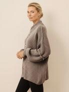 Oversized button-front knit cardigan with balloon sleeves and gold-tone buttons