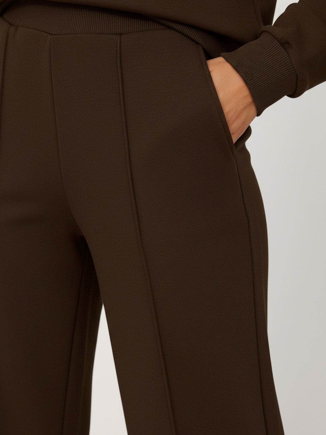 Wrinkle-free polo set with structured quarter-button top and high-waisted pants in breathable fabric