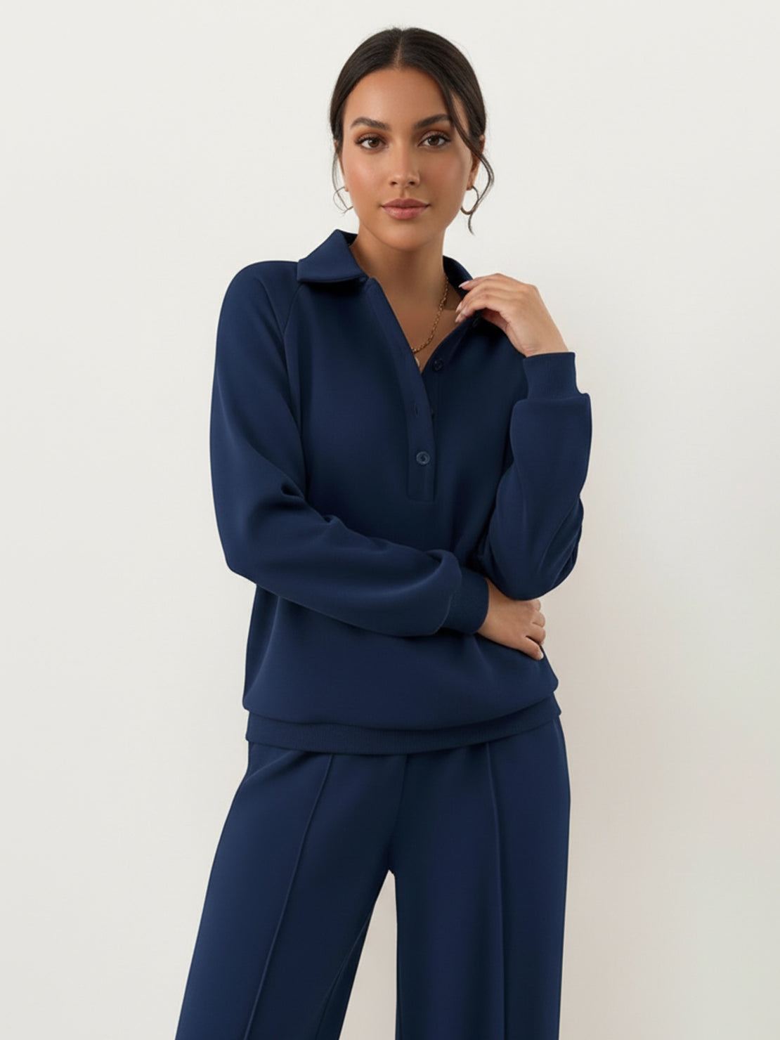 Women's wrinkle-free polo set with structured quarter-button top and high-waisted pants in breathable fabric