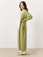 Long Australian Merino Wool cardigan with open front and patch pockets in natural wool knit