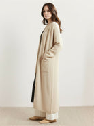 100% Australian Merino Wool longline open-front cardigan with patch pockets and ribbed cuffs