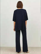 Oversized long-line loungewear set with short-sleeve pullover and straight-leg pants in soft knit fabric