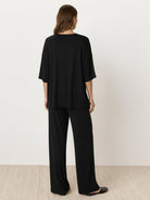 Oversized long-line loungewear set with pullover and wide-leg pants in soft knit fabric