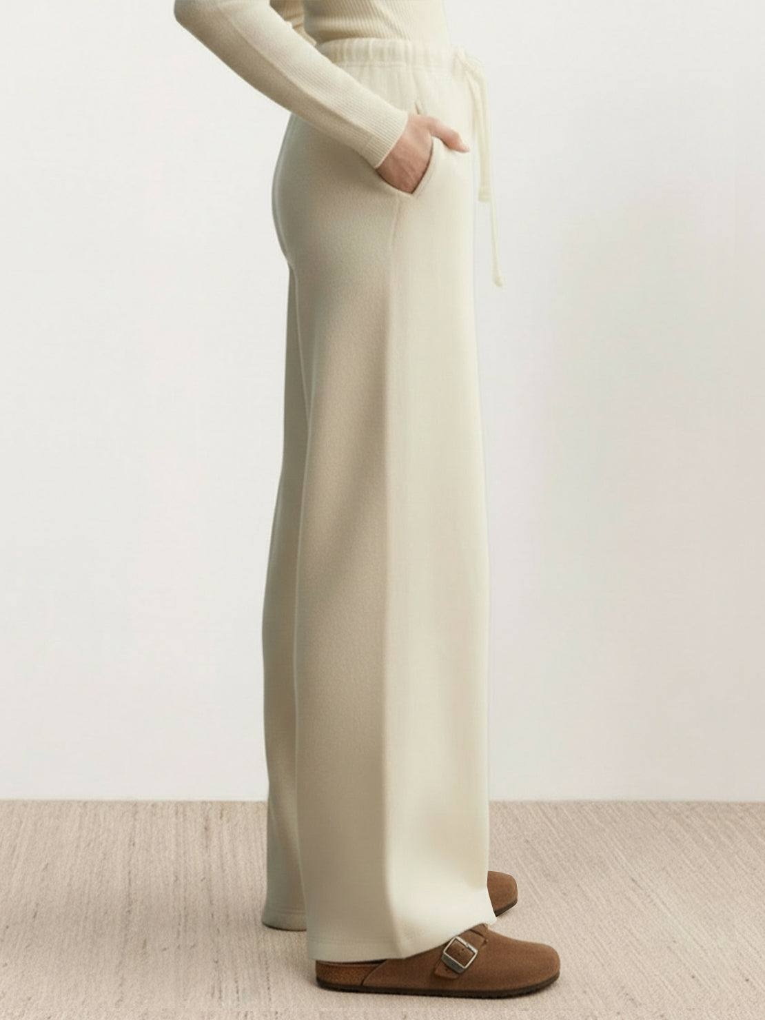Lightweight wool wide leg pants in neutral color with relaxed fit and soft brushed fabric