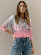 floral button-down shirt with long roll-up sleeves and relaxed hip-length fit