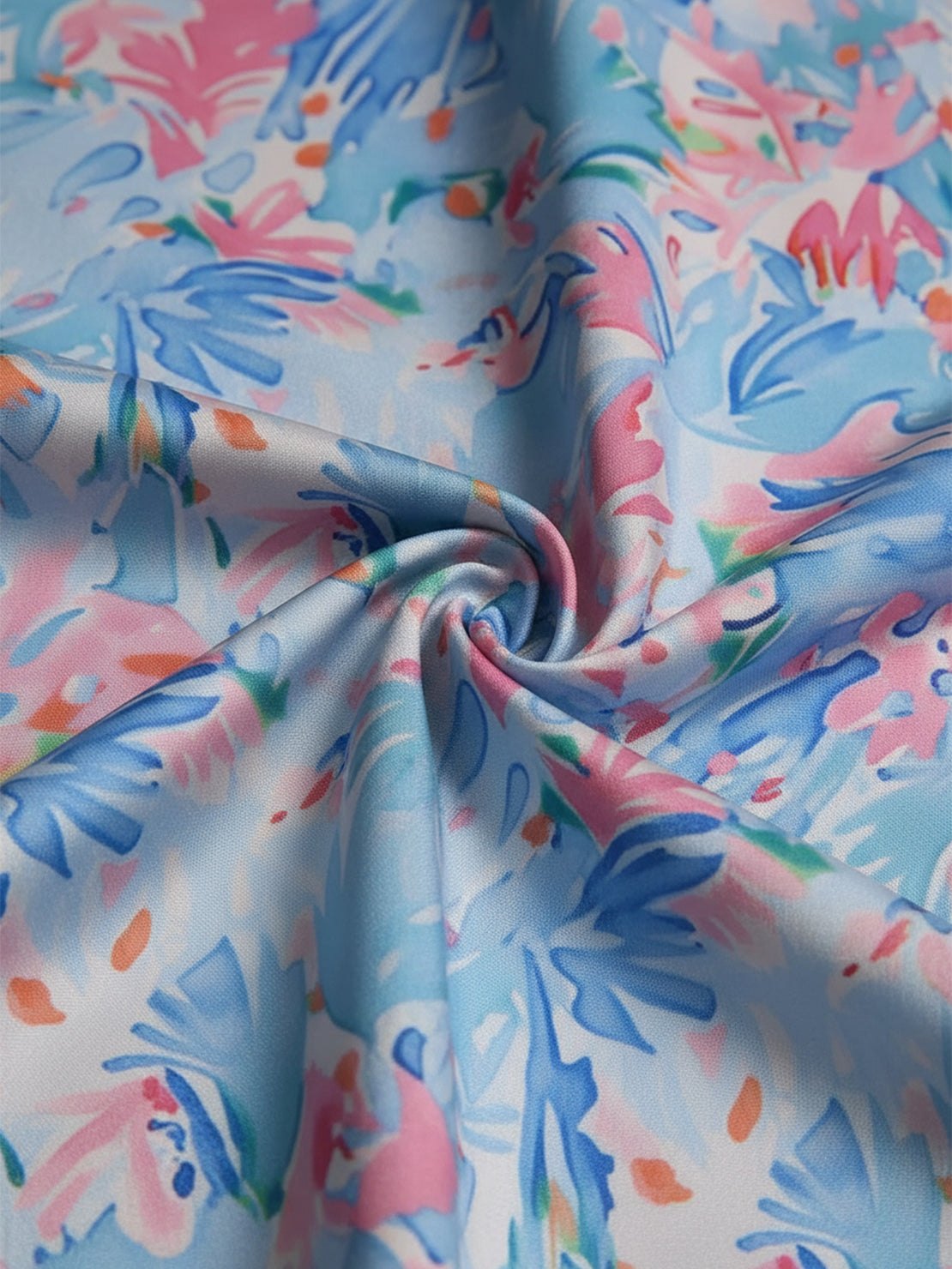 Hip-length floral button-down shirt with long roll-up sleeves and relaxed fit