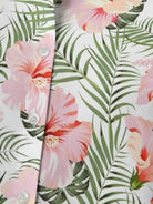 Floral button-down shirt with long roll-up sleeves and relaxed hip-length fit