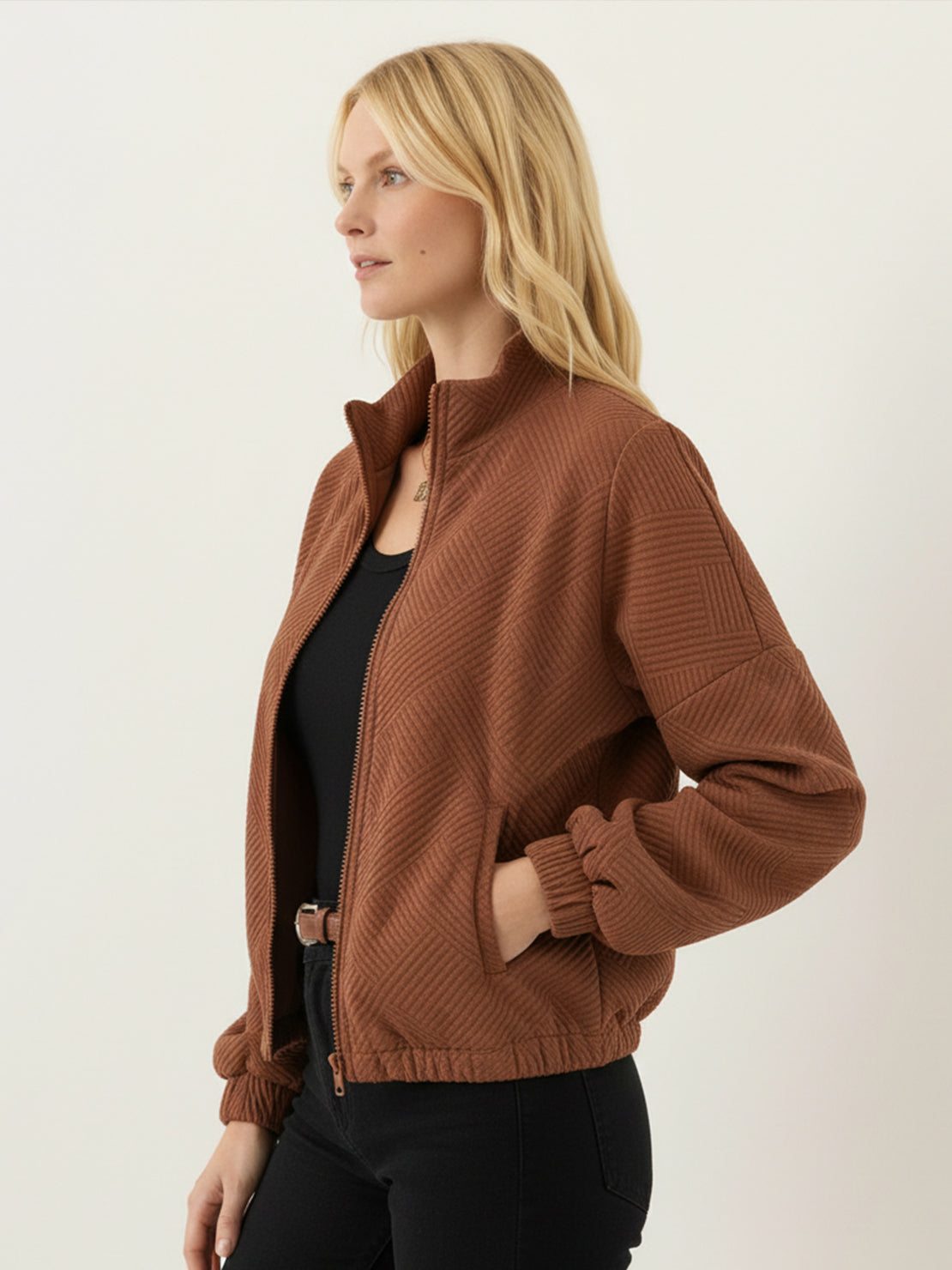 Cropped textured baseball jacket with full zipper, stand collar, and elastic cuffs and waistband.