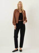 Cropped textured baseball jacket with full zipper and elastic cuffs, ideal for casual wear and layering