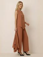 Woman wearing a lightweight open-front three-piece co-ord with longline cardigan, tank top, and wide-leg trousers