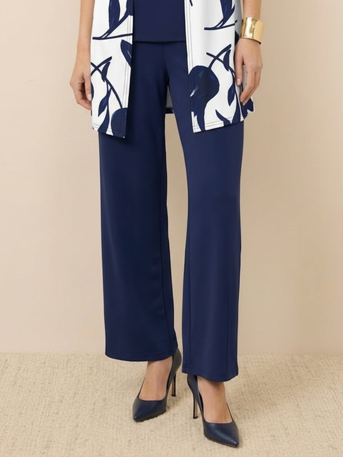 Woman wearing open-front three-piece co-ord with longline cardigan, tank top, and wide-leg trousers in lightweight knit fabric