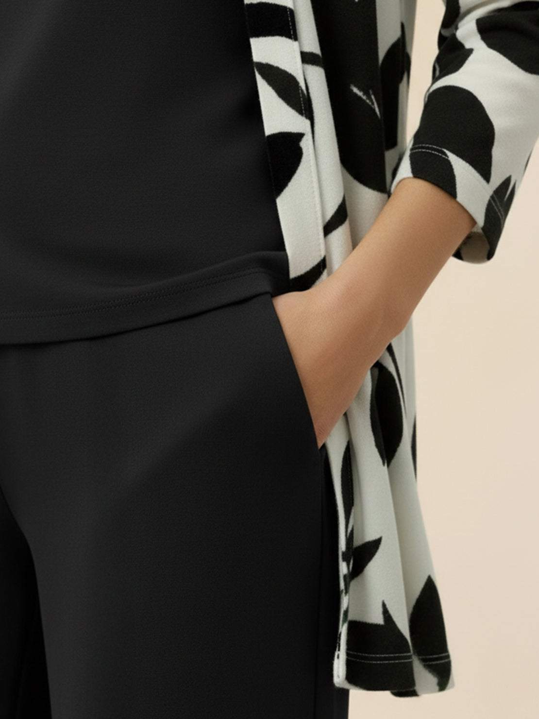 Open-front longline cardigan with three-quarter sleeves, matching wide-leg trousers, and round-neck tank top three-piece co-ord set