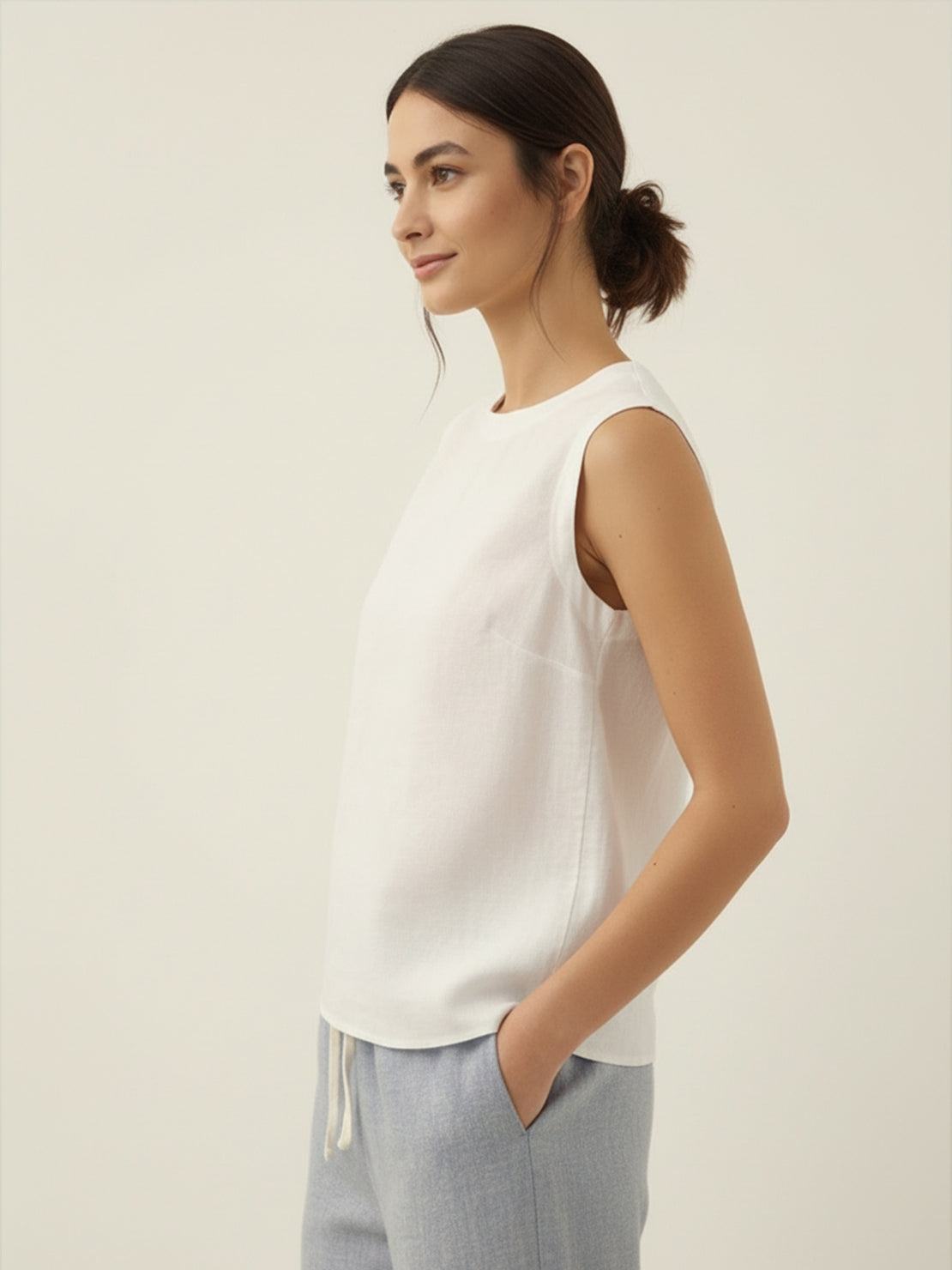 White cotton-linen sleeveless top with round neckline and back button closure