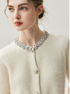 100% Alashan cashmere diamond-collar cardigan with crystal buttons, fine-gauge ribbed knit, and relaxed fit