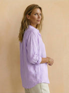 Lightweight 100% cotton popover blouse with relaxed fit, classic collar, and curved hem.