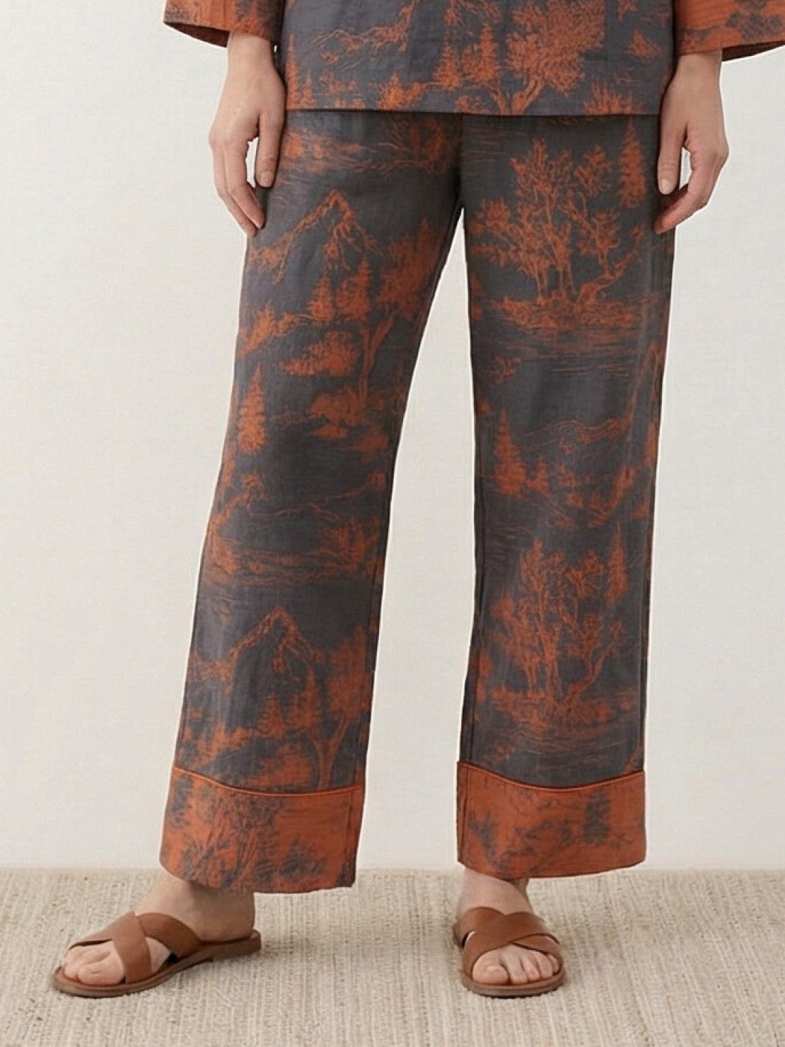 100% cotton Chinese Pankou pajamas set with tunic top and wide-leg pants featuring traditional frog closures and bold landscape print