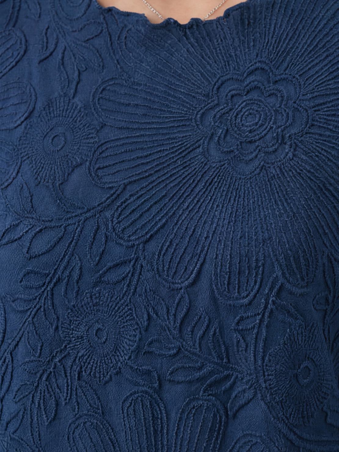 Floral Jacquard Pleated Top with 3D floral texture, flutter sleeves, and relaxed A-line silhouette